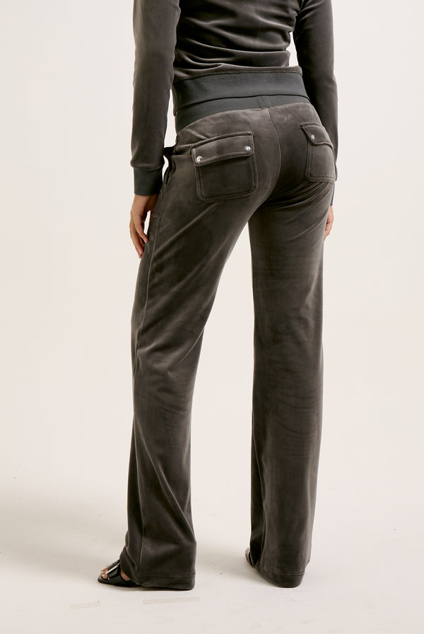 Displays a model wearing the Top Hat 'Juicy' branded classic velour del ray pocketed bottoms 