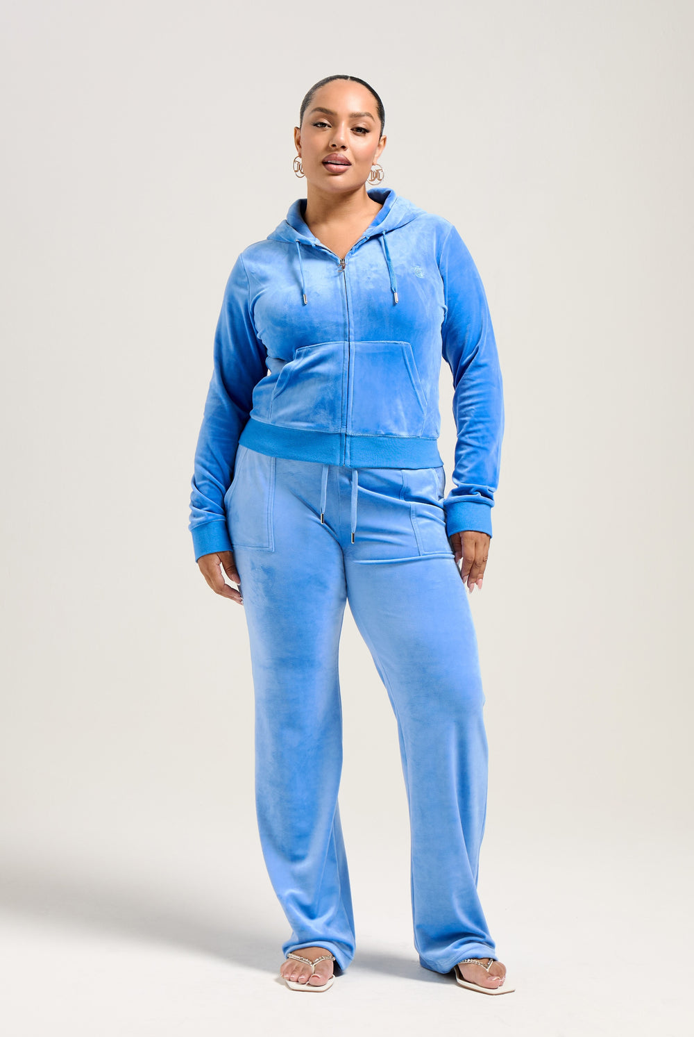 Displays a model wearing the Regatta 'Juicy' branded classic velour Robertson hoodie 