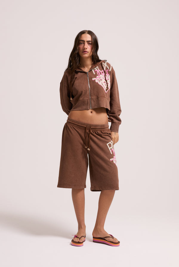 Displays a model wearing the Tiramisu Roxy & Juicy couture relaxed jorts 