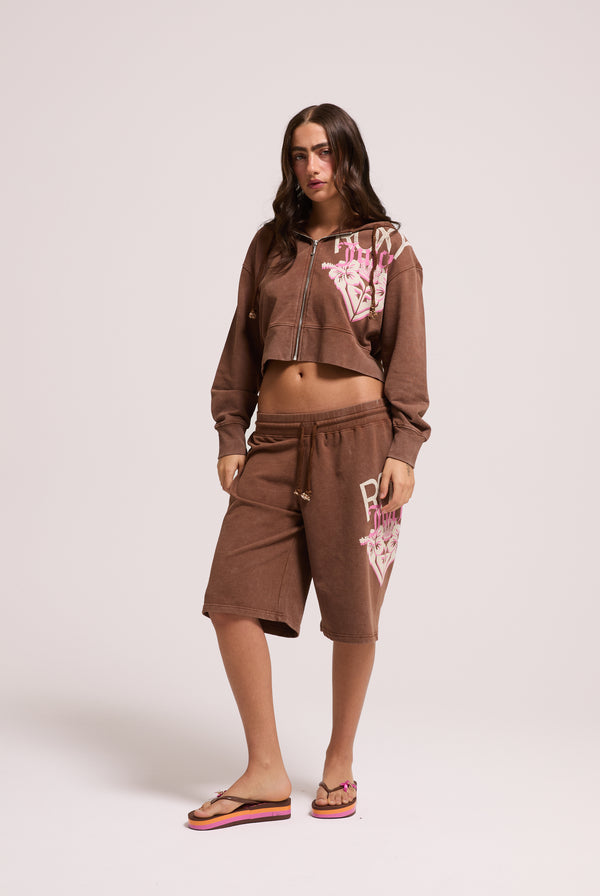 Displays a model wearing the Tiramisu Roxy & Juicy couture relaxed jorts 