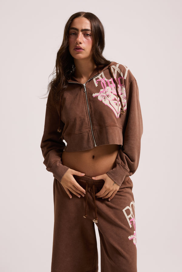 Displays a model wearing the Tiramisu Roxy & Juicy couture relaxed jorts 
