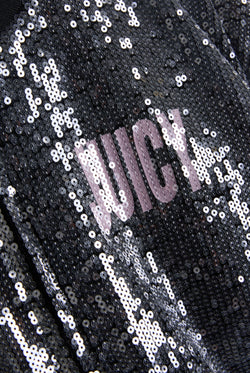 Displays the 'juicy' branded choose juicy sequin cropped bomber featuring the juicy branding 
