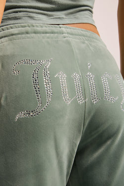 Displays the chinois green 'Juicy' velour diamanté tracksuit bottom featuring the juicy branding 