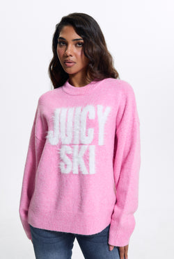 Displays a model wearing the Begonia Pink 'Juicy' branded Juicy Ski Knit Jumper