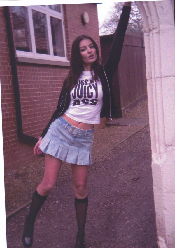 Displays a model wearing the White 'Juicy' branded KISS MY JUICY tee 