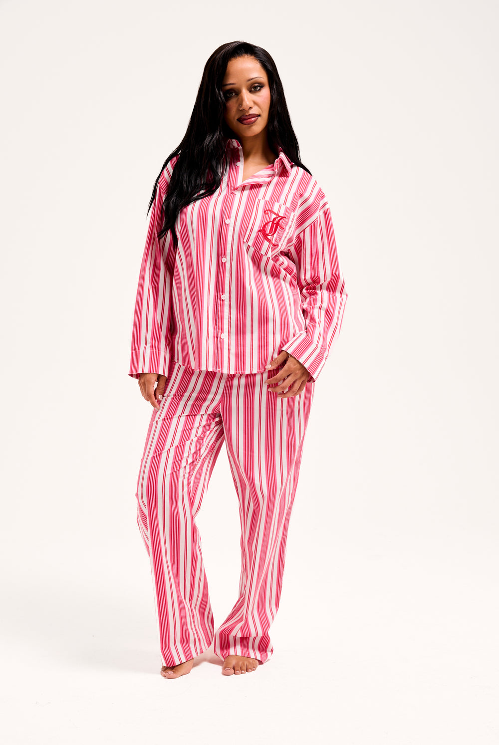 Displays a model wearing the Pink Stripe 'Juicy' branded oversized sleep shirt 
