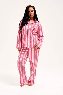Displays a model wearing the Pink Stripe 'Juicy' branded oversized sleep shirt 