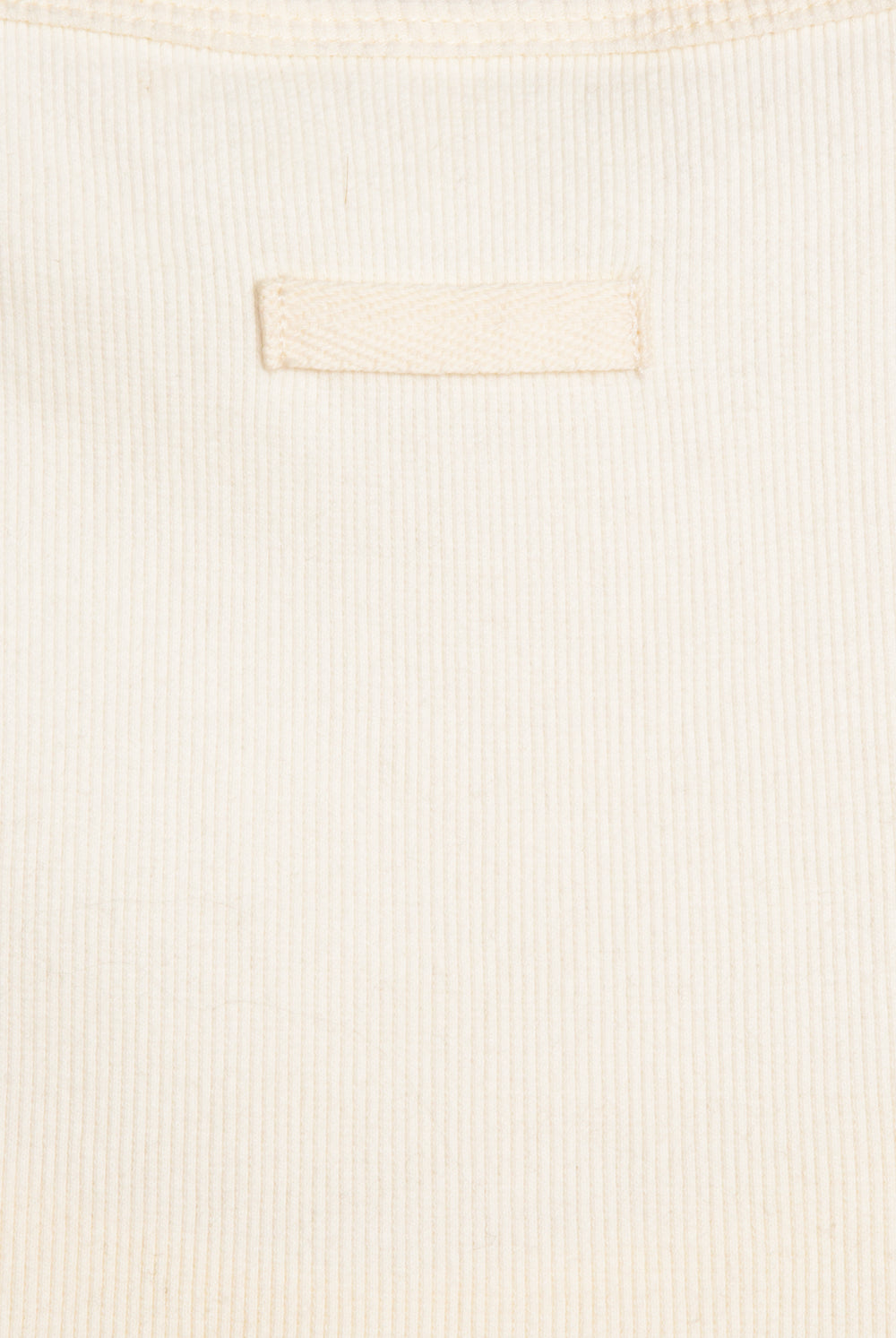 Displays the White 'Juicy' branded longline ribbed vest 
