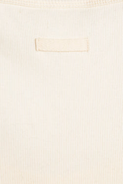 Displays the White 'Juicy' branded longline ribbed vest 