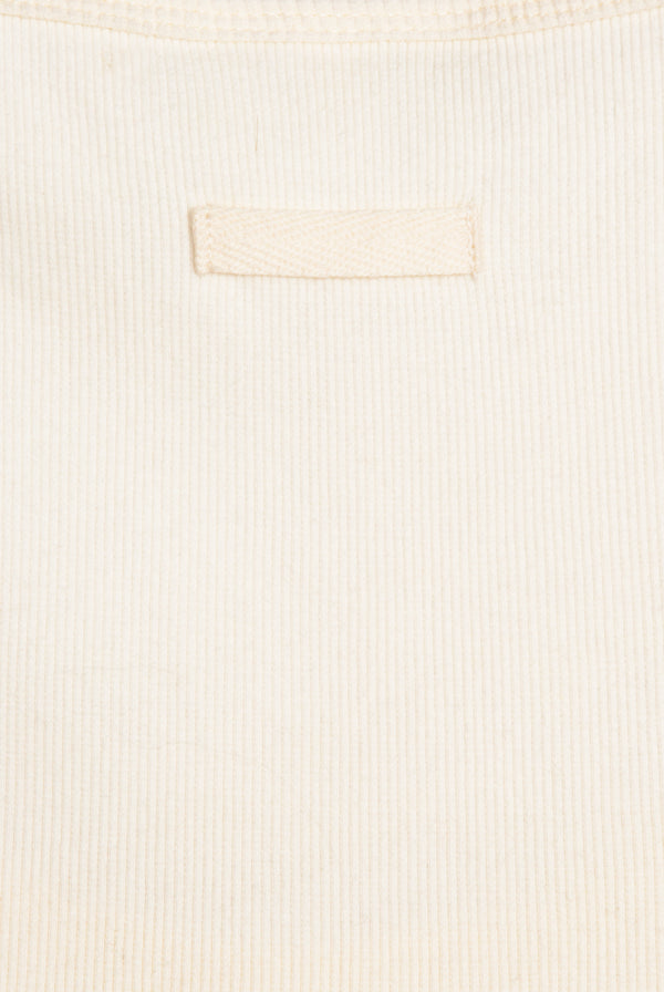 Displays the White 'Juicy' branded longline ribbed vest 