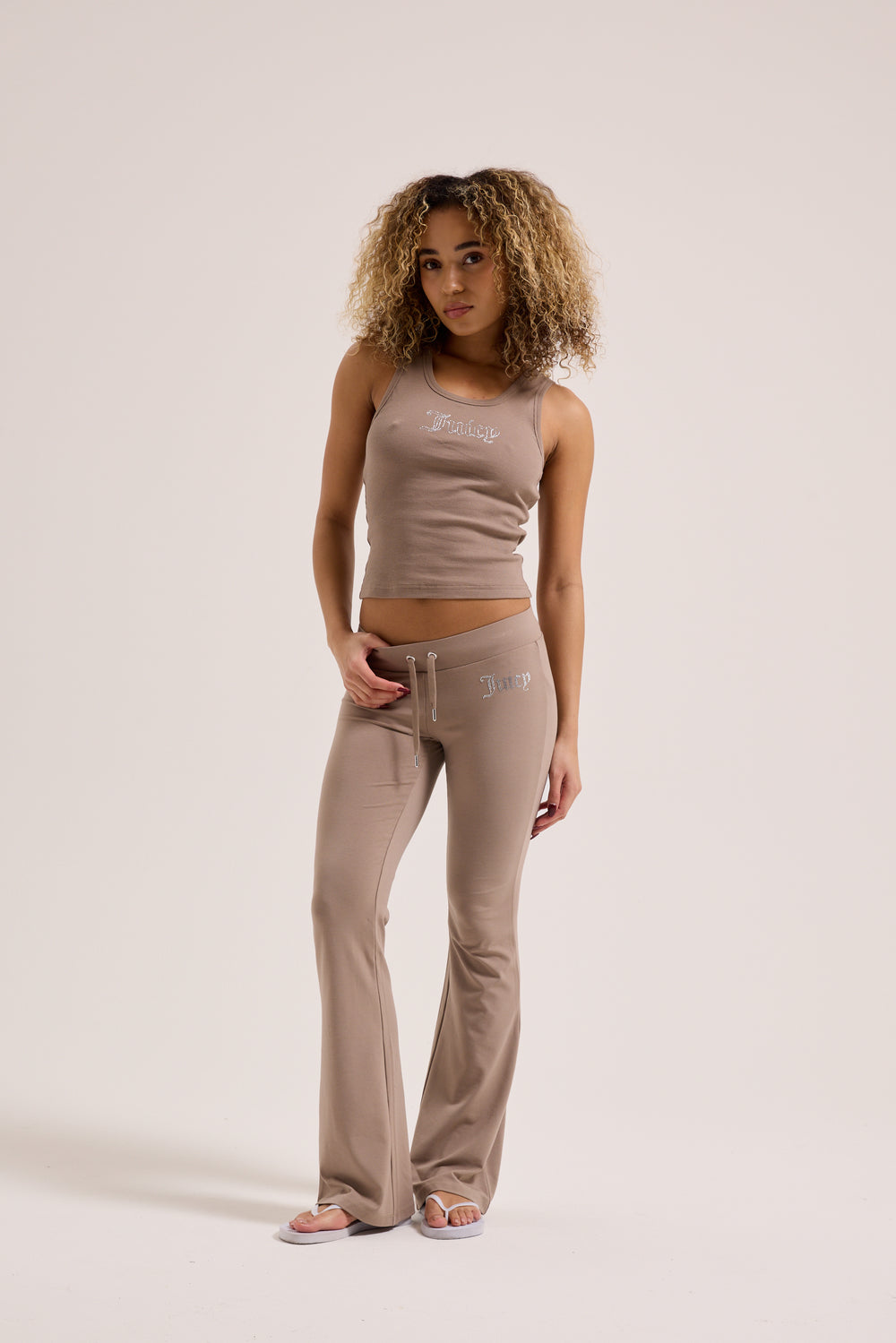 Displays a model wearing the fungi 'Juicy' branded ribbed outline diamanté racer vest 