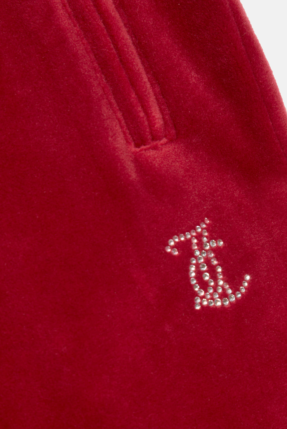 Displays the Red Dahlia 'Juicy' branded velour diamanté tracksuit bottom featuring the juicy couture logo 