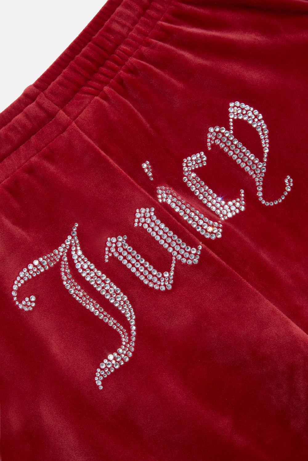 Displays the Red Dahlia 'Juicy' branded velour diamanté tracksuit bottom featuring the juicy branding 