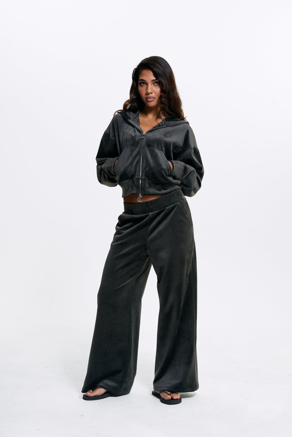 Displays a model wearing the Raven 'Juicy' branded Velour Bonded Tracksuit Bottom