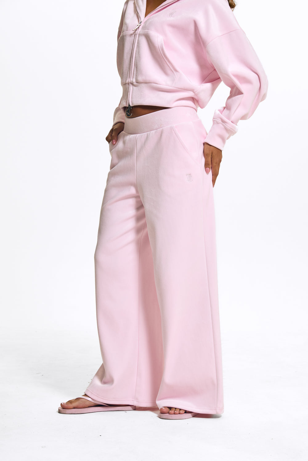 Displays a model wearing the Cherry Blossom 'Juicy' branded Velour Bonded Tracksuit Bottom