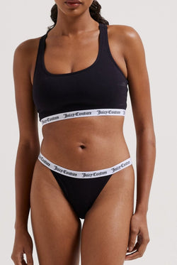 Displays a model wearing the Black 'juicy' branded cotton bralette
