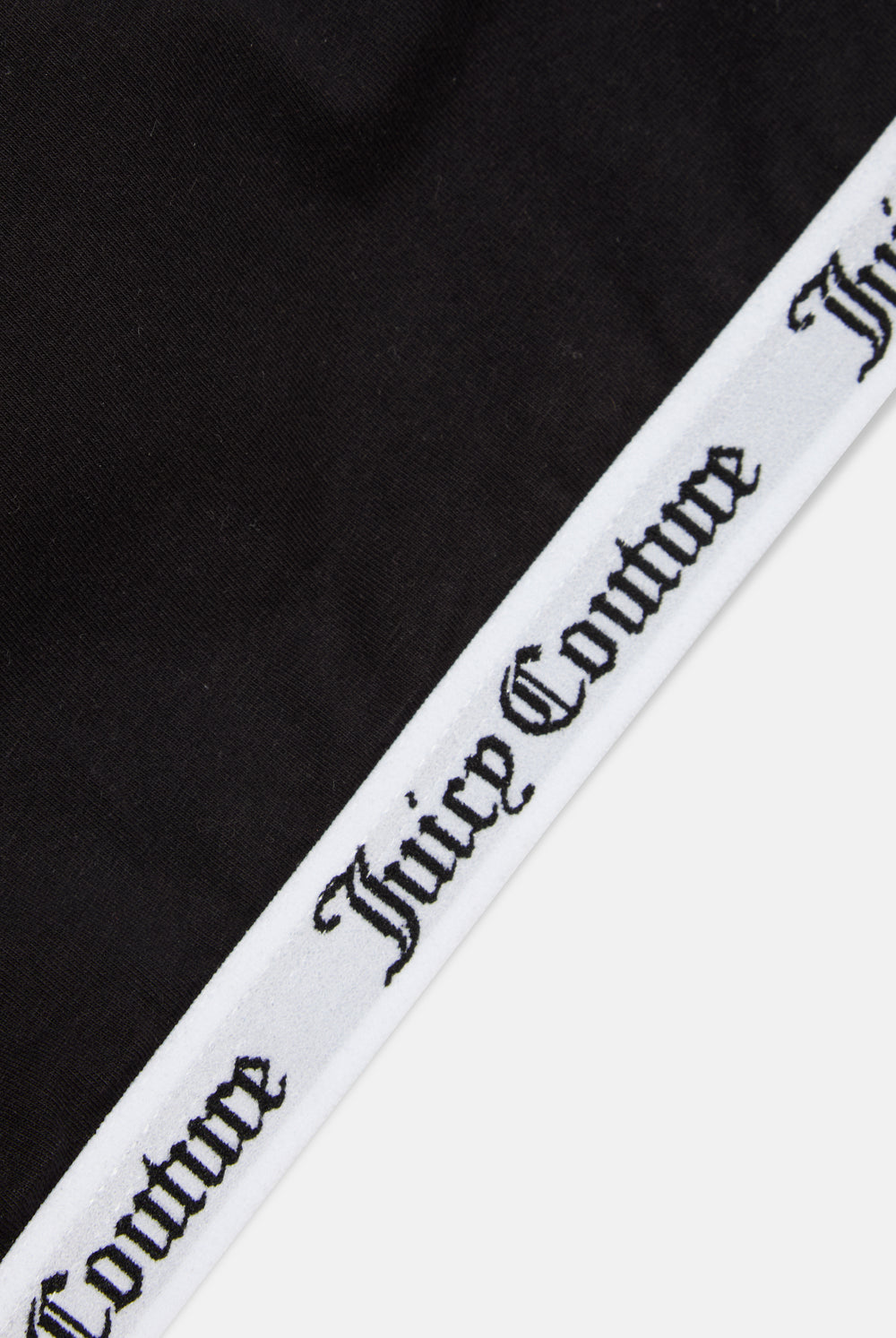 Displays the Black 'juicy' branded cotton bralette featuring the juicy Couture branding