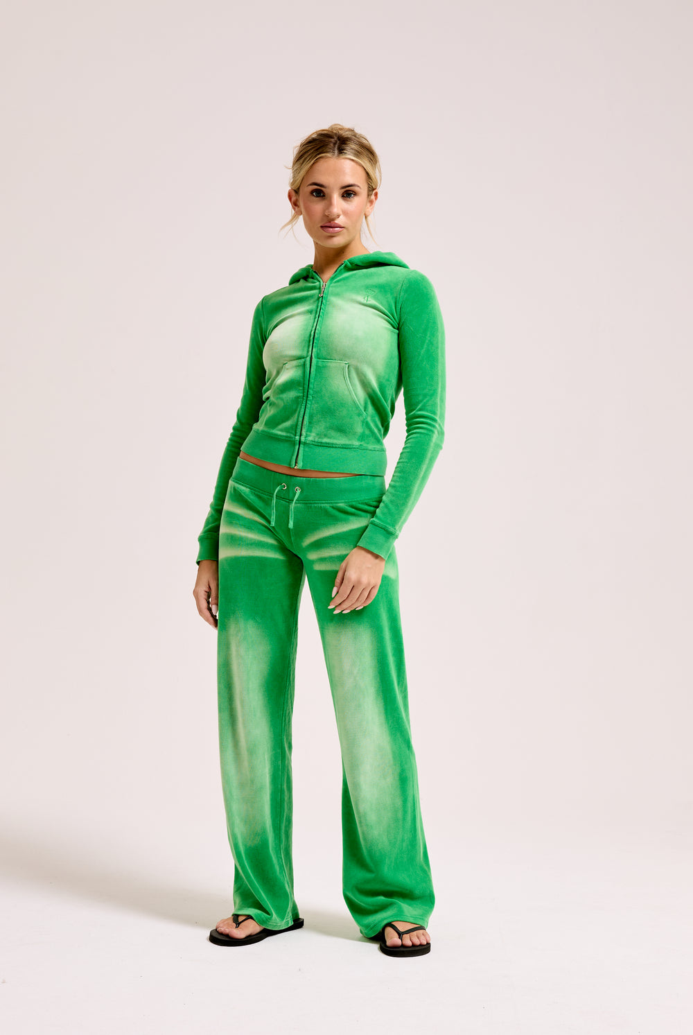 Displays a model wearing the Jolly Green washed 'juicy' branded cotton velour fitted hoodie 