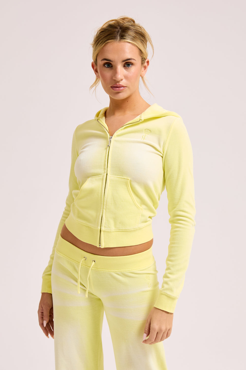 Display a model wearing the Yellow Pear washed 'Juicy' branded cotton velour fitted hoodie 