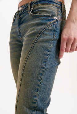 Displays a model wearing the Vintage Wash 'Juicy' branded western diamanté flared jeans 